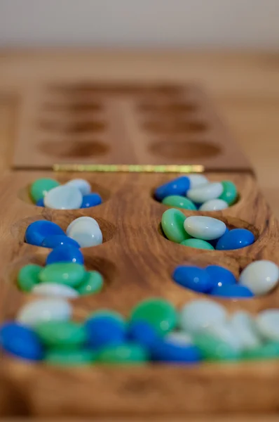 Mancala, jogo de tabuleiro tradicional — Fotografia de Stock