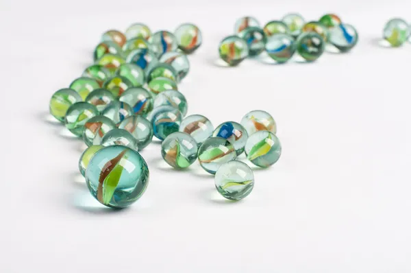 Glass marbles on the white background — Stock Photo, Image