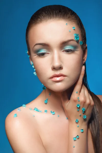 Beautiful naked young woman covered with blue crystals — Stock Photo, Image