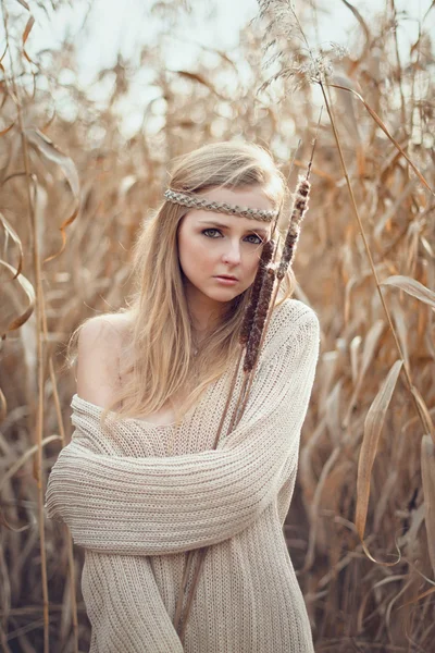 Beautiful blond girl with a mirror in the reeds — Stock Photo, Image