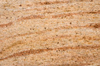 Granit doku, granit kaplama arka plan, sarı mermer taş. Eski bina faşizminin dekoratif unsurları. Metin için boş boşluk.