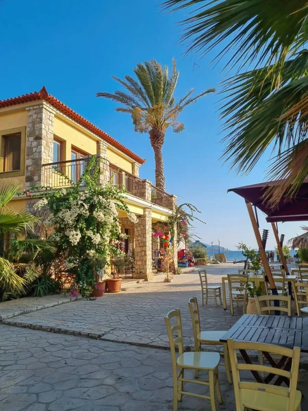 The European house. Yellow home with red tiled roof. yellow house in greece