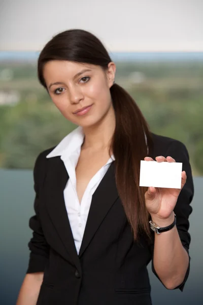 Businesswoman holding blank business card — Stock Photo, Image