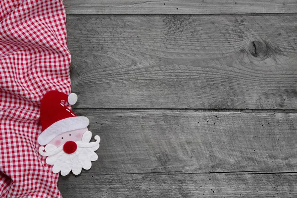 Tissu à carreaux avec tête de Père Noël — Photo