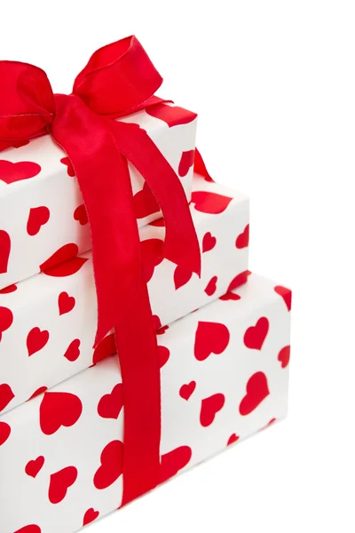 Giftboxes zawinięte w papier serca wzorzyste — Zdjęcie stockowe