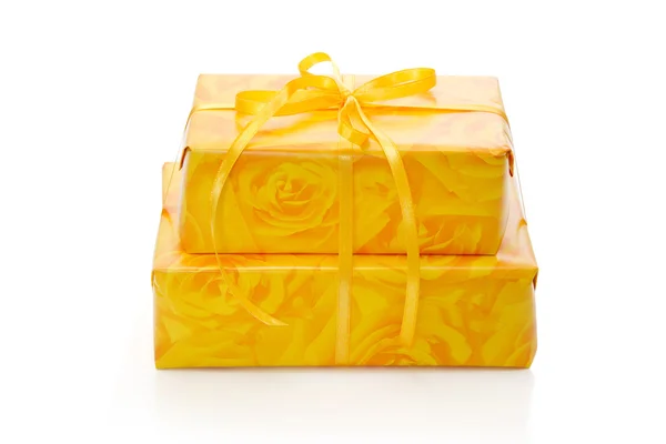 Presents wrapped in yellow paper — Stock Photo, Image