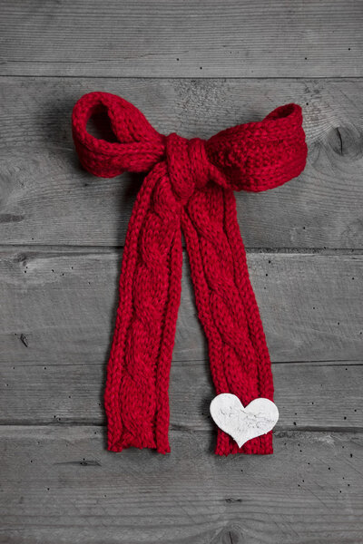 Red knitted bow with white heart