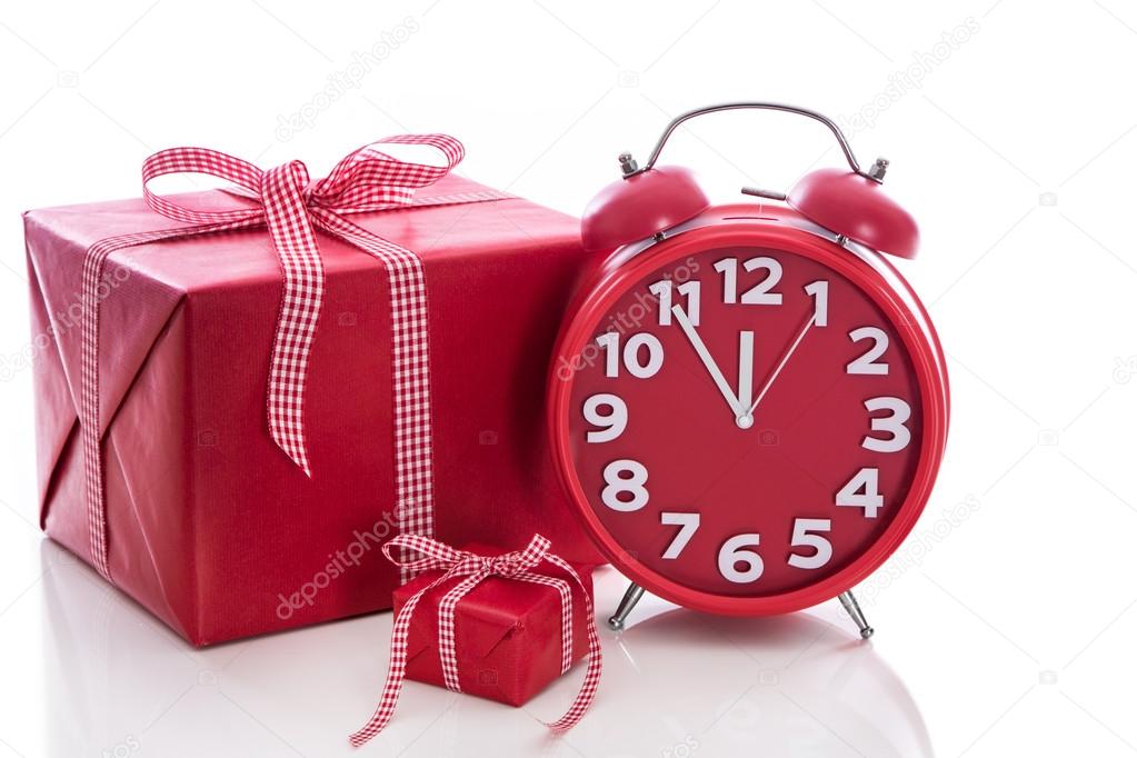 Big gift box with red alarm clock