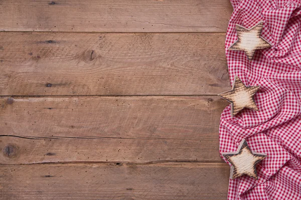 Trä bakgrund med stjärnor i julklapp — Stockfoto