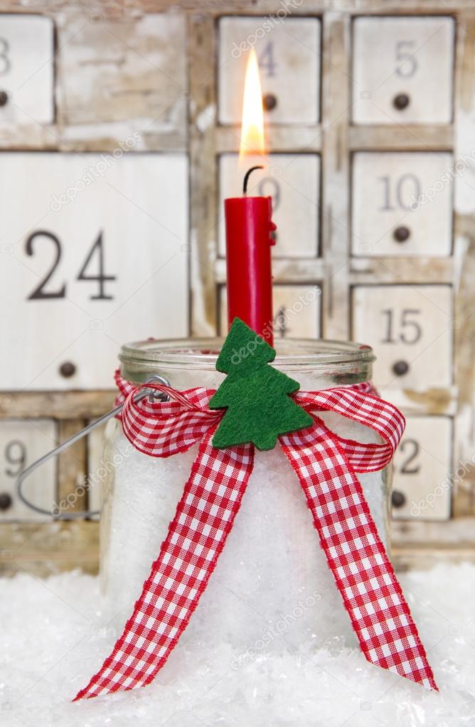 Advent candle with a red checkered bow