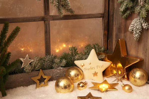Christmas ornaments on window sill — Stock Photo, Image