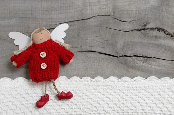 Red Christmas angel on grey wooden background — Stock Photo, Image