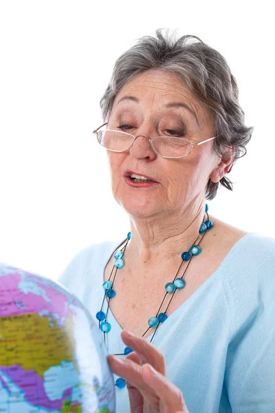 Senior woman with globe — Stock Photo, Image