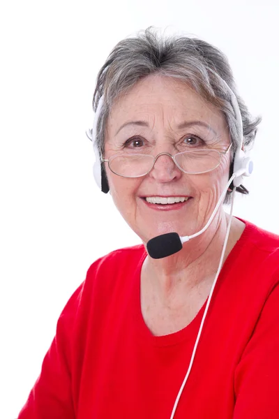 Mulher sênior com fone de ouvido — Fotografia de Stock