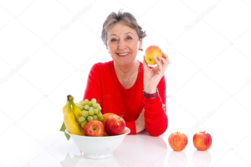 Elderly woman with fruits