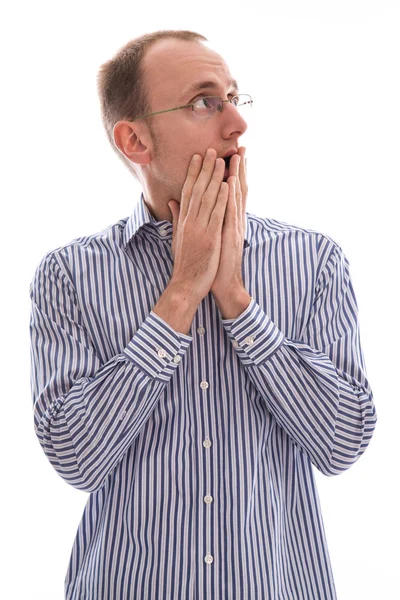 Surprised man looking up over his shoulder with his hands — Stock Photo, Image