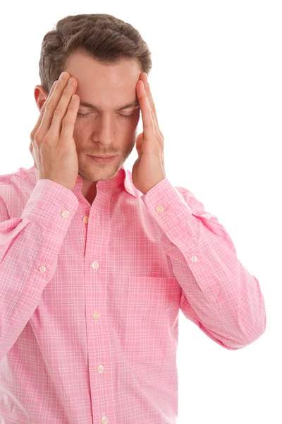 Stressed young man in pink with head in hands isolated on white Stock Photo