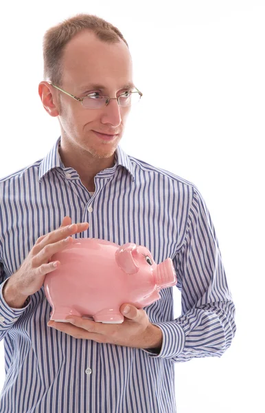 Hombre sosteniendo alcancía rosa ahorro de dinero aislado —  Fotos de Stock