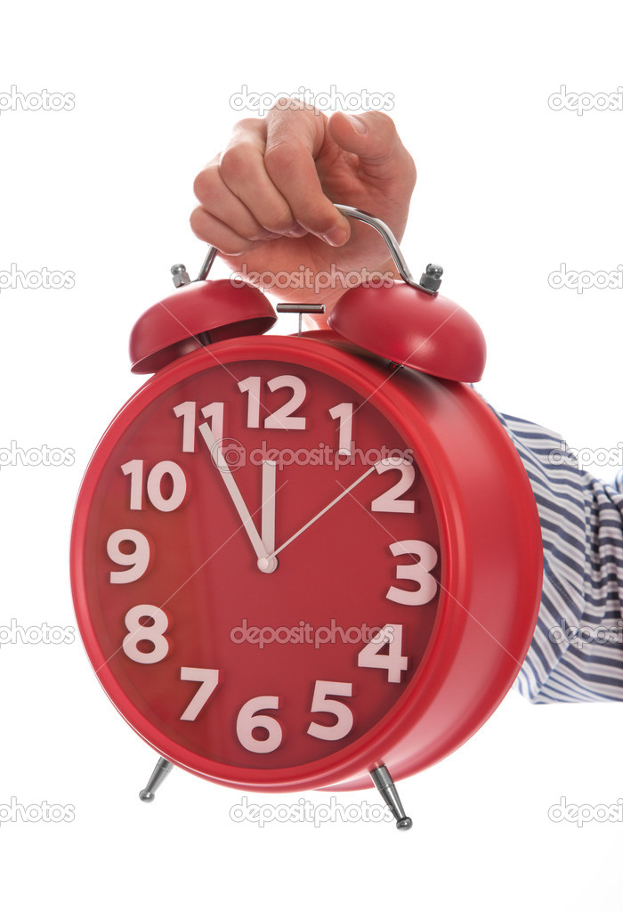 Symbol of time : hand holding red clock , eleventh hour isolated