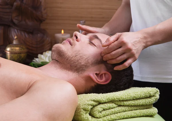 Hands of woman making massage to a man — Stock Photo, Image