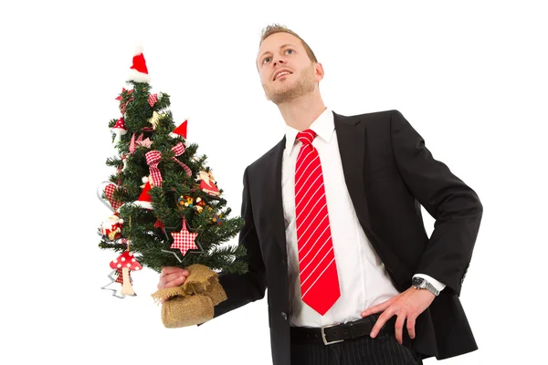 Business man holding christmas tree — Stock Photo, Image
