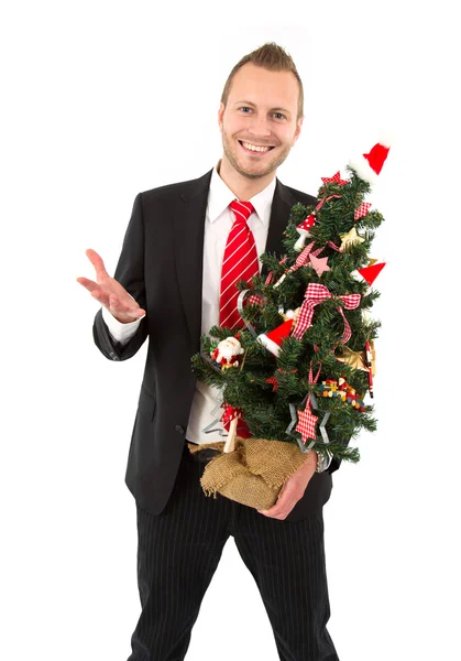 Ο άνθρωπος των επιχειρήσεων με το χριστουγεννιάτικο δέντρο — Φωτογραφία Αρχείου