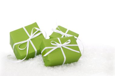 Green gift box tied with white ribbon - present isolated for christmas clipart