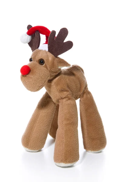 Plush reindeer with Santa hat isolated with a red christmas hat — Stock Photo, Image