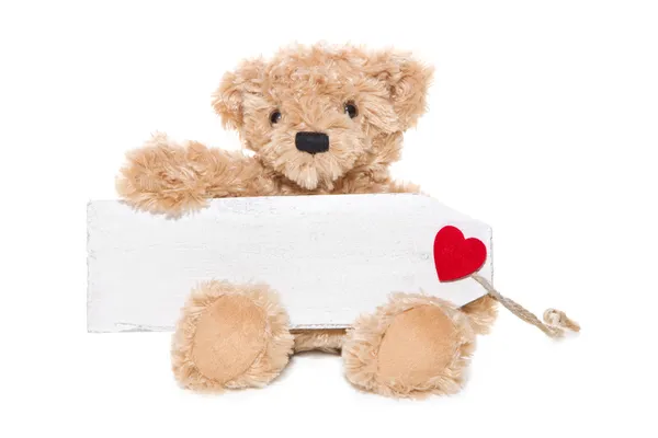 Weihnachten Teddybär mit Botschaft mit rotem Herz isoliert auf weißem Hintergrund — Stockfoto