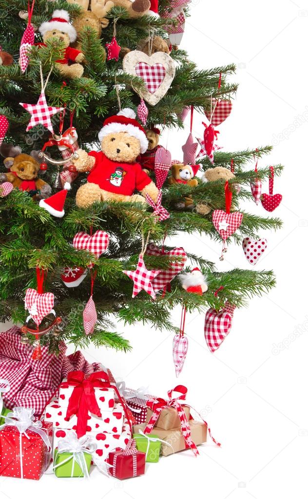 Colorfully decorated isolated Christmas tree with red decoration