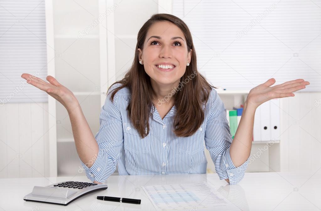 Young woman is happy at work in their office