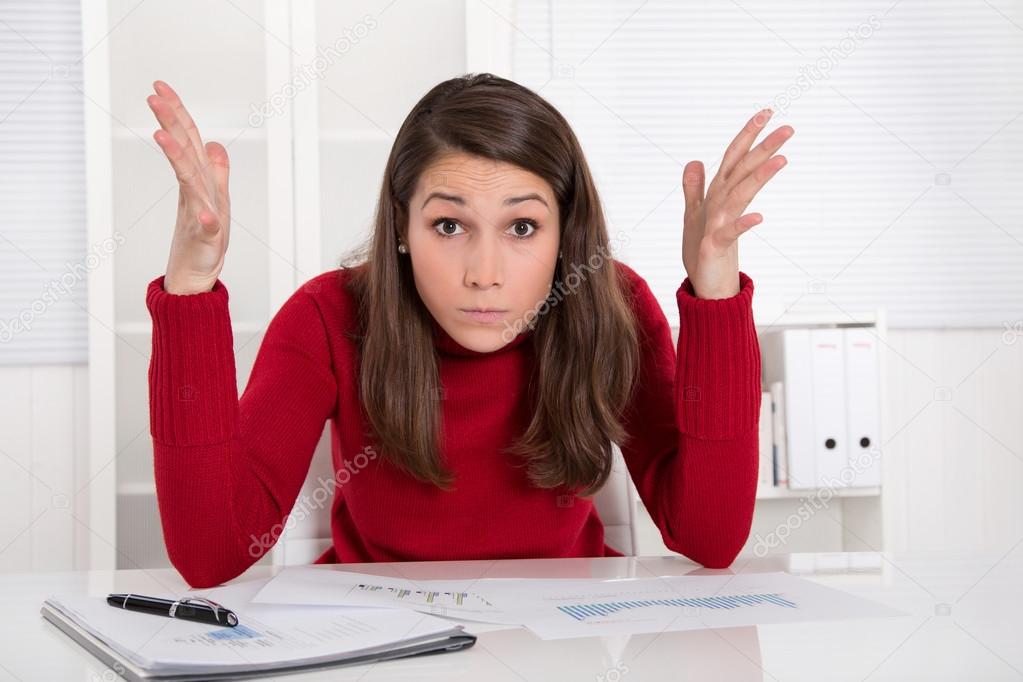 Hands up - young businesswoman has concentration problems at studying or lerning
