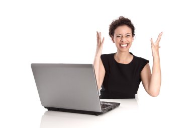 Powerful sucessful young business woman with computer in the office clipart