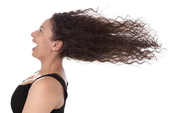 Winderig: Profiel van lachende vrouw met haar waait in de wind geïsoleerd op wit — Stockfoto