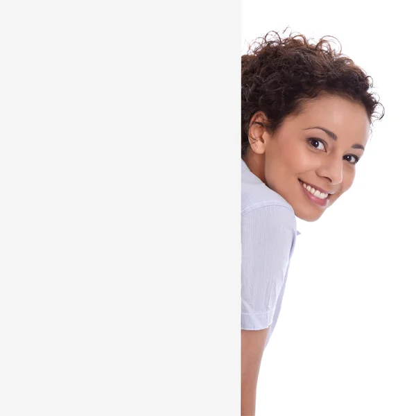 Sonriente joven mujer de negocios aislada hace promoción en un signo —  Fotos de Stock