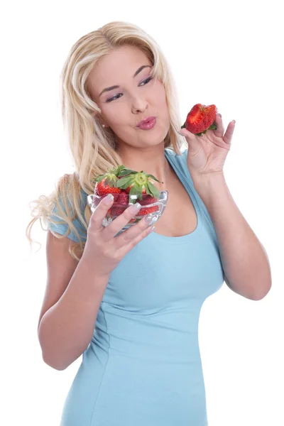 Frau isst Erdbeeren Stockbild