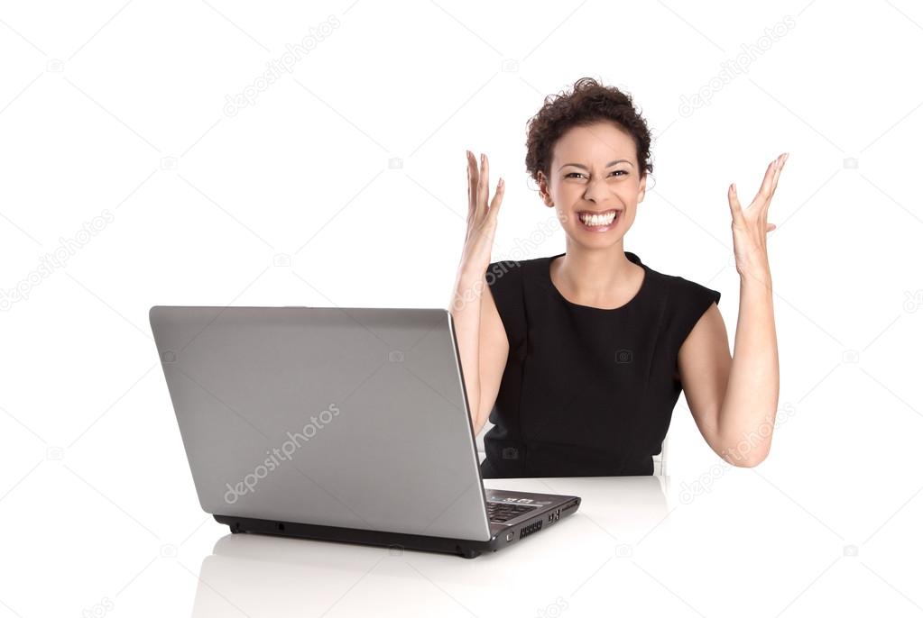 Powerful sucessful young business woman with computer in the office