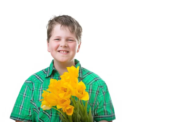 Мальчик с тюльпанами — стоковое фото