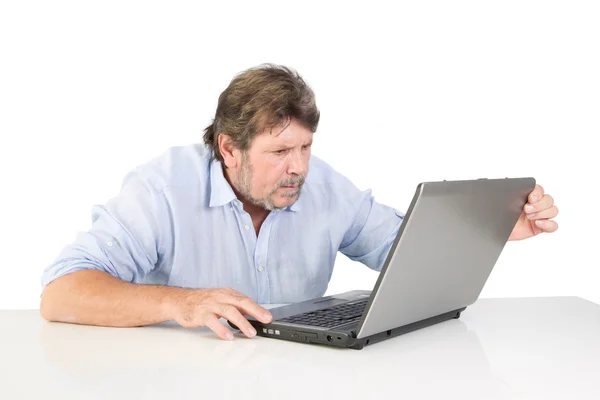Retired with his computer Royalty Free Stock Images