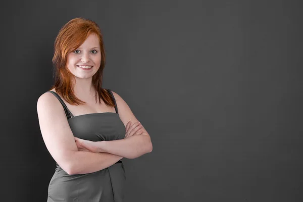 Red-haired girl with crossed arms — Stock Photo, Image