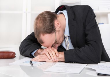 Frustrated manager with crisis sleeping at desk. clipart