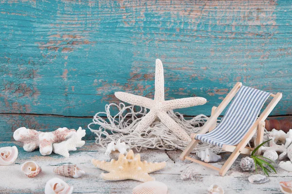 Starfish and shells with toy — Stock Photo, Image
