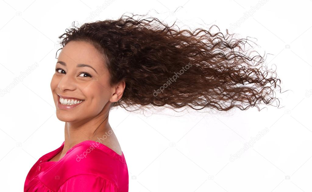 Windy: laughing woman with blowing hair in wind isolated on whit