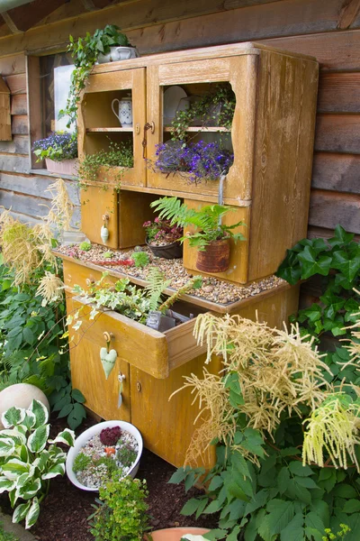 Old cupboard with flowers — Stock Photo, Image