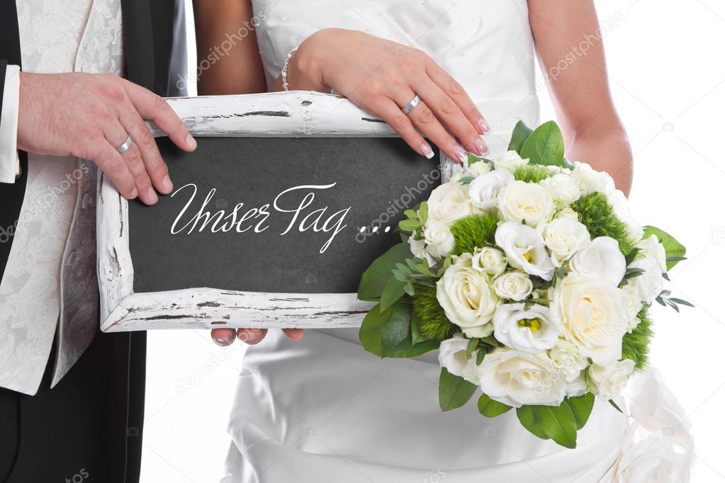Wedding couple with bridal Bouquet and chalkboard: our day ...
