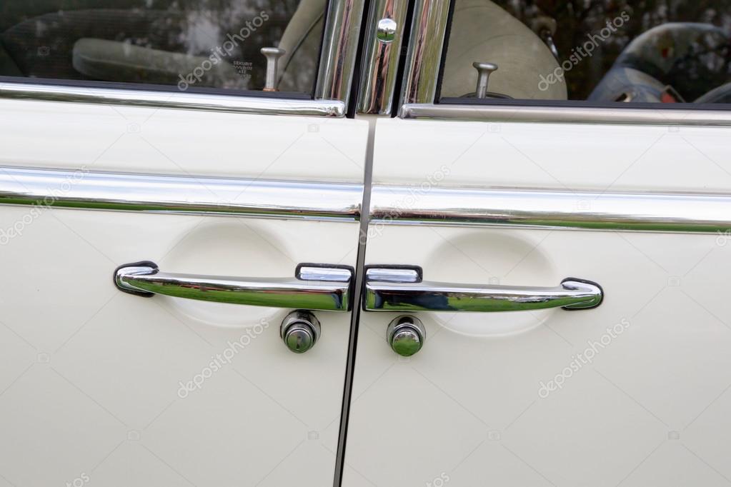 Suicide doors of a white oldtimer