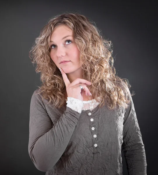 Thoughtful young woman — Stock Photo, Image