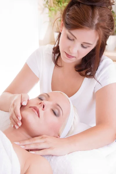 Woman relaxing during a massage Royalty Free Stock Photos