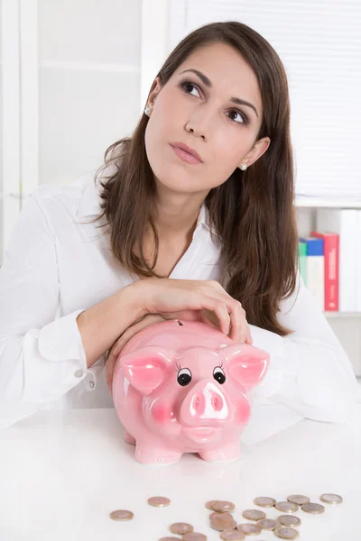 Young woman with her savings is dreaming of her next holiday Stock Image