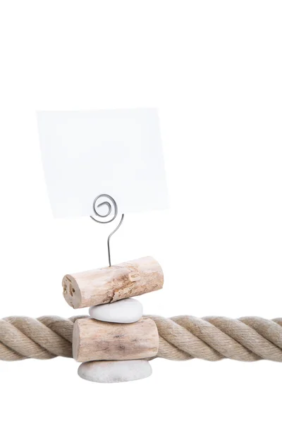 Sinal branco em um suporte de papel de madeira natural isolado na parte traseira branca — Fotografia de Stock